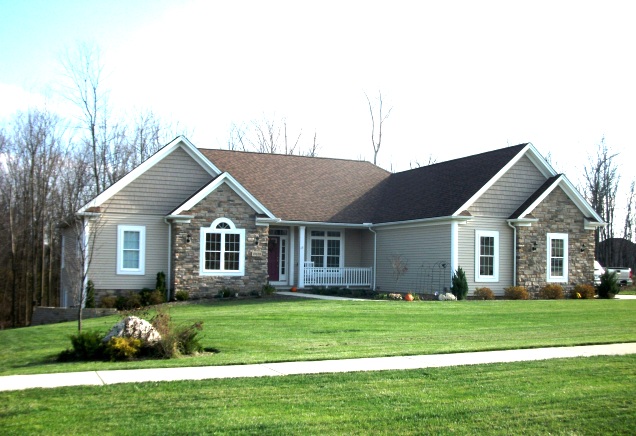 9' ceilings. Parlor/den with half-round window. Vaulted/cathedral ceilings in the foyer, great room, and kitchen. Gas or wood-burning fireplace. Formal dining room with high tray ceiling. Kitchen with attached breakfast room. Large master bedroom and bath. Covered front porch. 3-car side-entry garage.