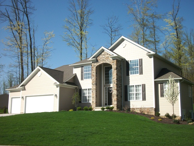 1st floor master with round box ceiling. Bridge overlooking 2 story foyer and great room with high arched windows and loft above. Formal dining room or parlor with tray ceiling. Large open kitchen with breakfast bar and walk-in pantry. Dinette with windows all around. 1st floor laundry. Walk-in closets. Covered entry with stone columns. Optional partial stone front. 2-car garage (optional 3rd car and/or side entry).