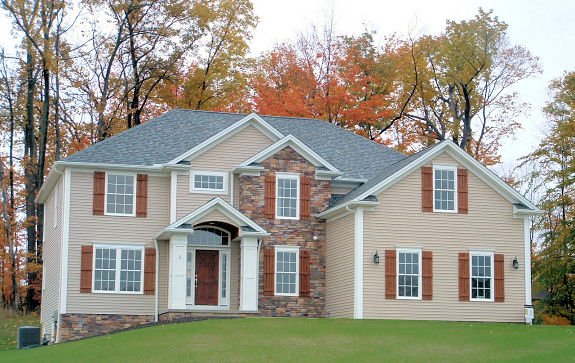 Study/den off of foyer with French doors. 1st floor mud room. 2nd floor laundry. Vaulted master bedroom with huge walk-in closet. Master bath with corner garden tub. 2-story foyer with loft. Sunk-in great room with 2-story ceiling. Large wall of windows. 2nd floor overlooks great room. Extra large kitchen/dinette area with walk-in pantry. Formal living/dining room with tray ceiling. Large covered front porch with deco columns. Side-entry 3-car garage.