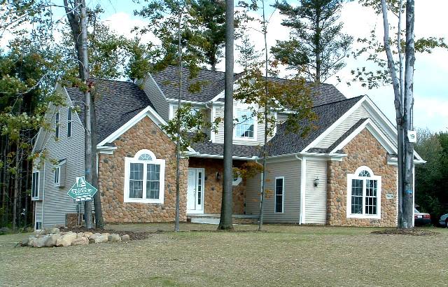 1st floor master suite with large walk-in closet and large shower. Loft overlooking great room and 2-story foyer. Sloped ceiling in great room and dinette. Formal dining room or parlor with cathedral ceiling. Half-round windows. Large 1st floor laundry. Covered front porch. 2-car side-entry garage.