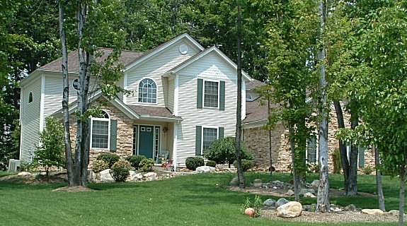 Sunk-in 1st floor master suite with optional see-thru fireplace to vaulted master bath. 2 story foyer and great room with 2 story fireplace and plant shelves. Loft overlooking great room and foyer. Vaulted parlor/den. Tray ceiling in dining room. 1st floor laundry. Covered front porch. 2-car garage.