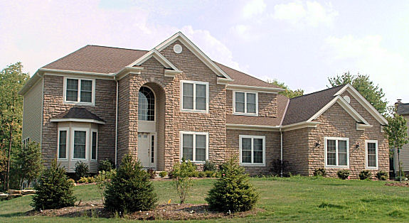 9' ceilings on 1st floor. 1st floor parlor/guest room with closet. 2-story foyer and great room with bridge above overlooking. Formal dining room with box ceiling. 1st floor office/den. Master suite with vaulted ceiling, large walk-in closet, and glamour bath with corner tub. Large kitchen with walk-in pantry and breakfast bar/island. Sunroom with boxed ceiling. Side-entry 3-car garage.